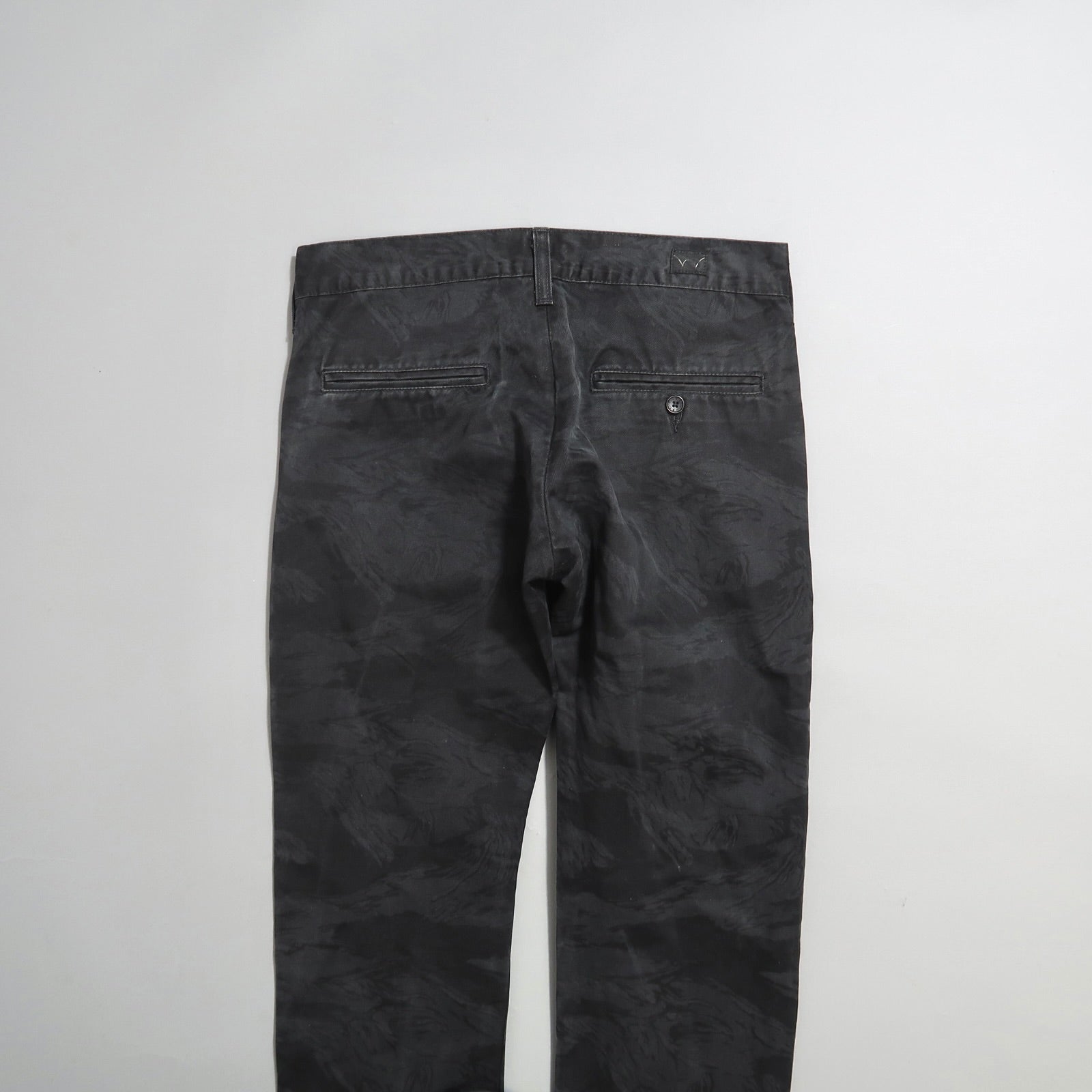 Dark gray pants with back pockets displayed against a plain background.