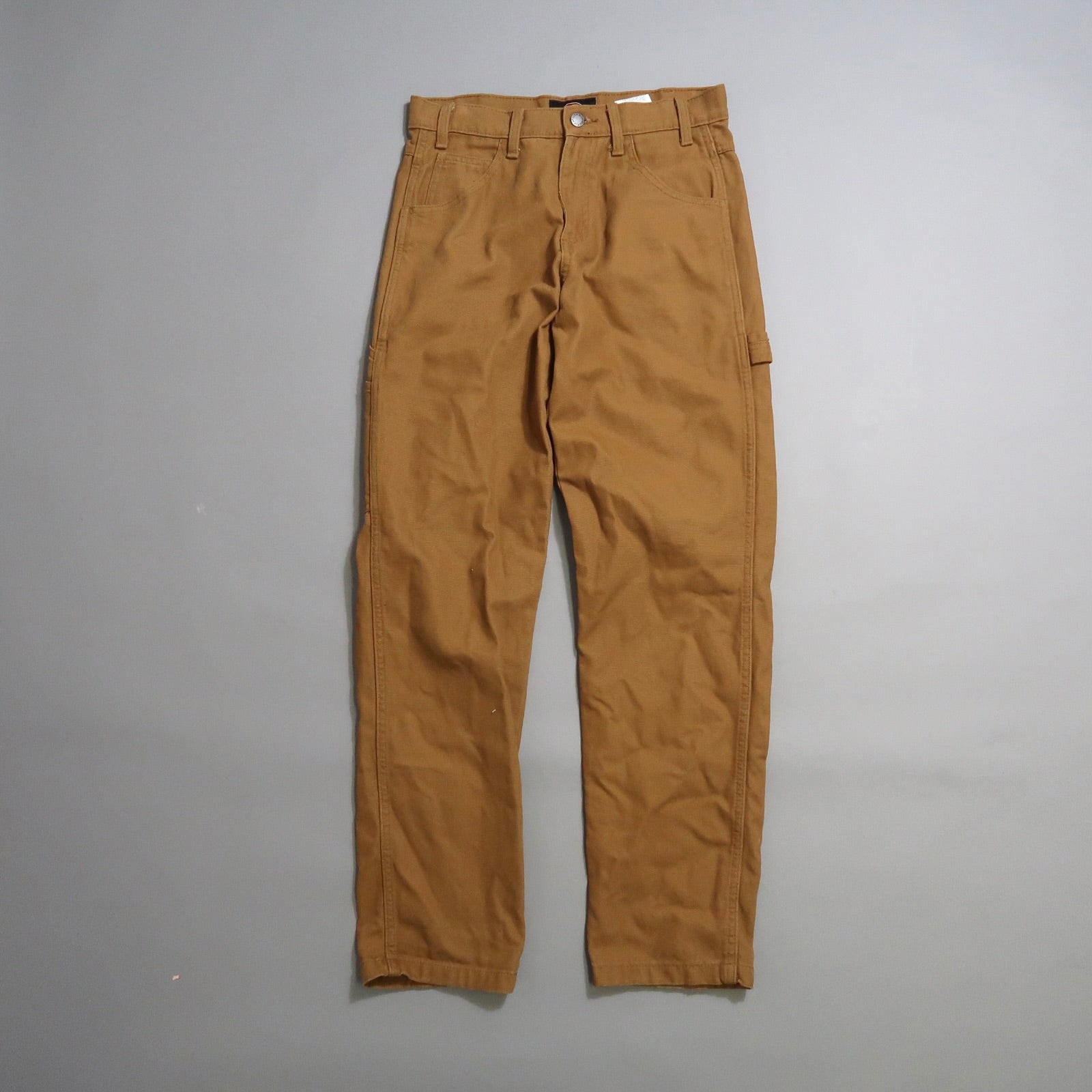 Brown work pants on a gray background.