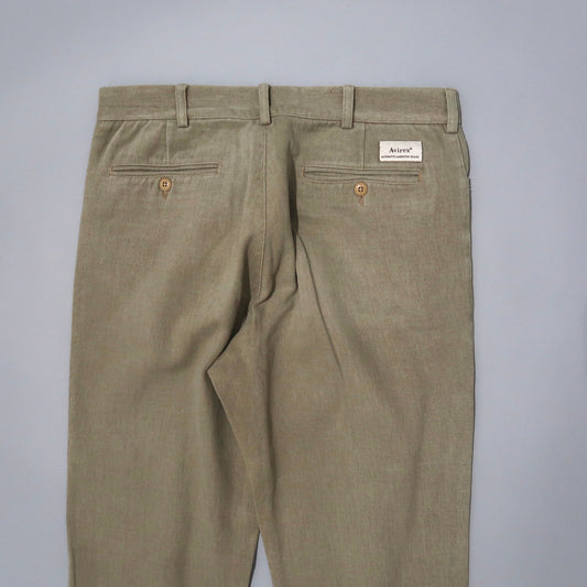 Khaki pants with belt loops and buttoned back pockets on display.