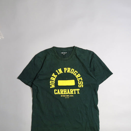 Green Carhartt T-shirt with yellow nullWork in Progressnull text.