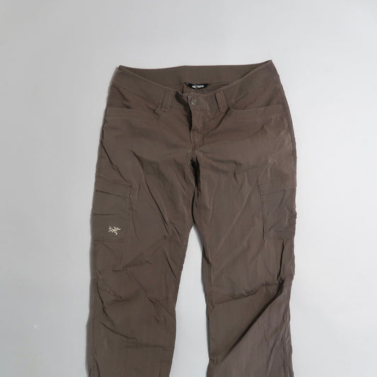 Brown cargo pants with pockets on a white background.