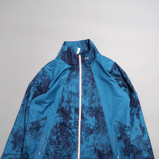 Blue and black patterned jacket with a high collar and zipper.