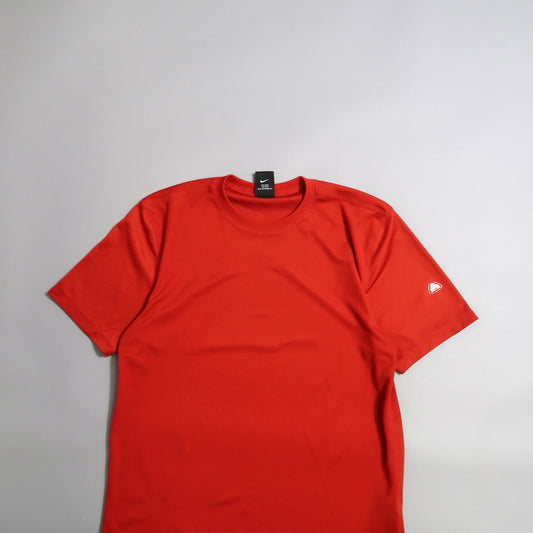 Red T-shirt with a black label on a plain white background.