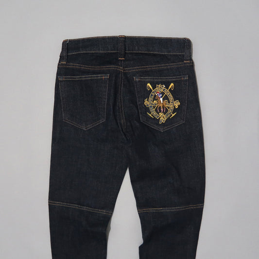 Dark jeans with detailed embroidery on the back pocket.