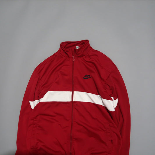 Red Nike jacket with a white stripe on a gray background.