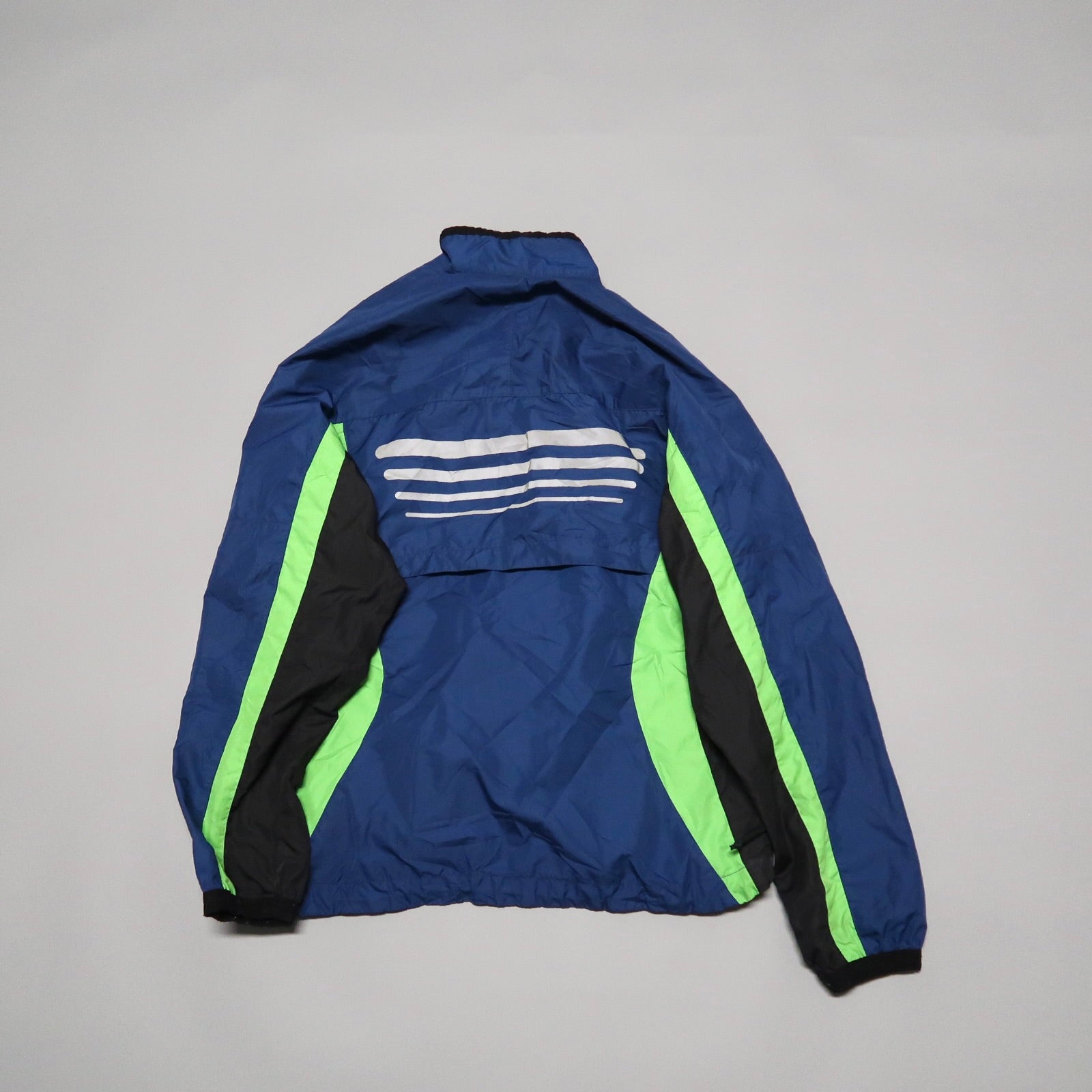 Blue and green jacket with white stripes on the back.