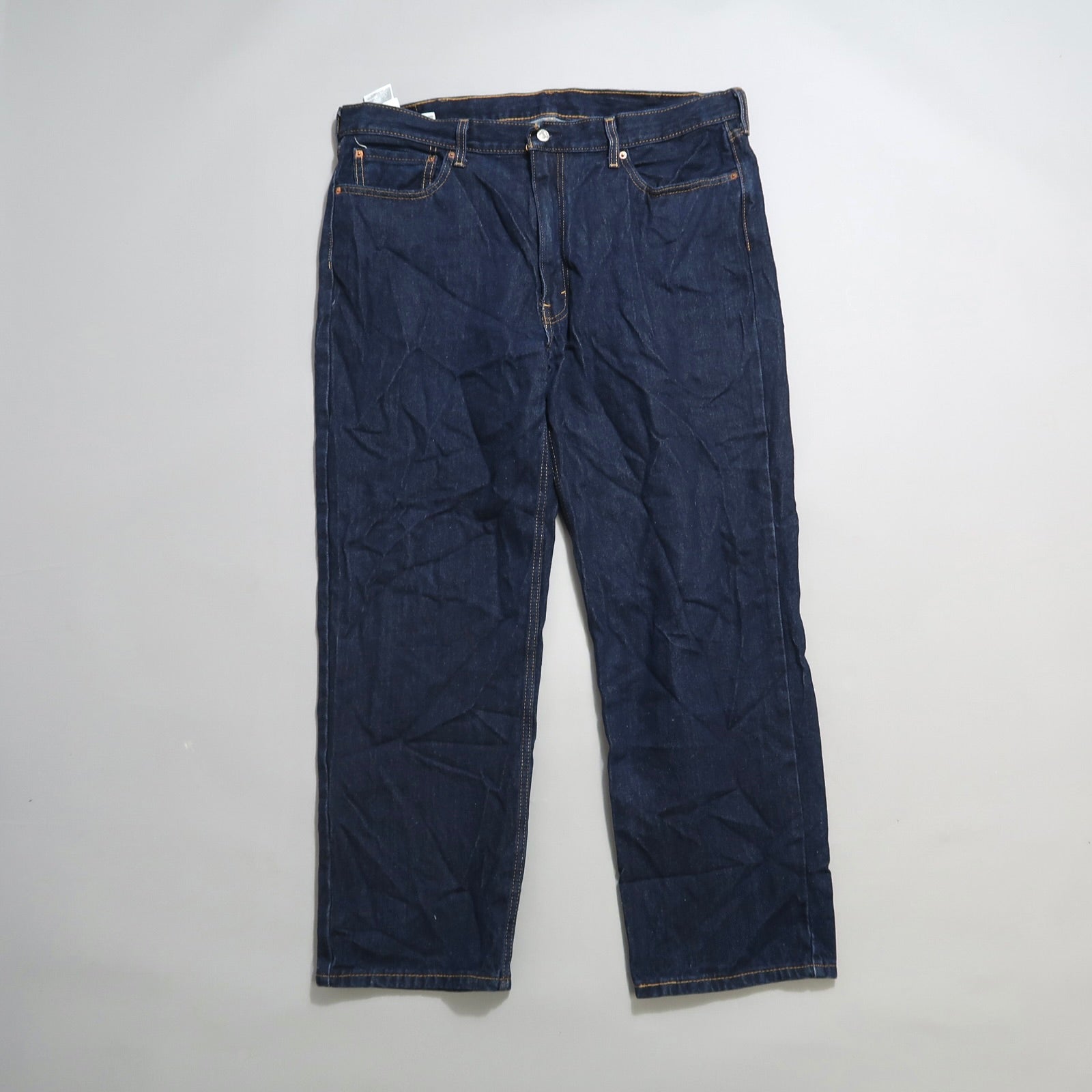 Dark blue straight-leg denim jeans on a light background.