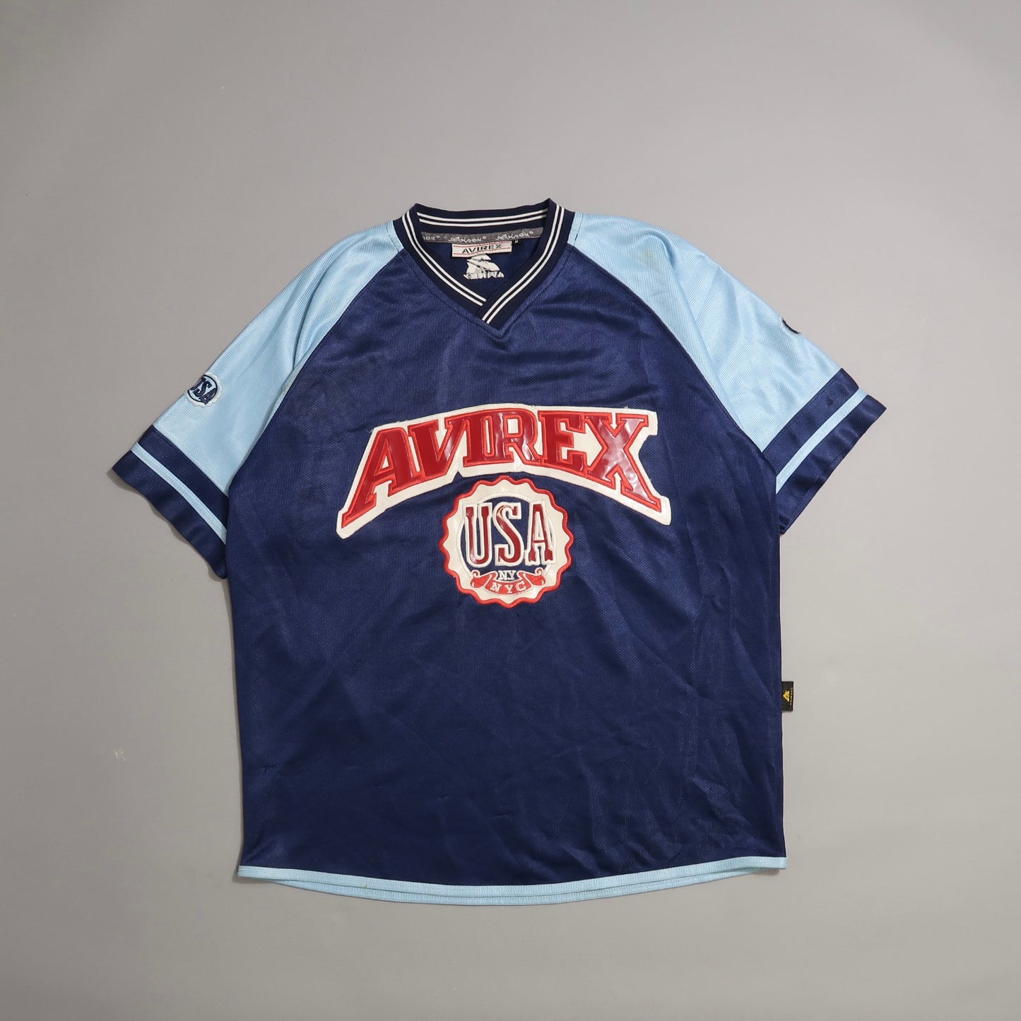 Blue and light blue Avirex USA jersey with red logo.