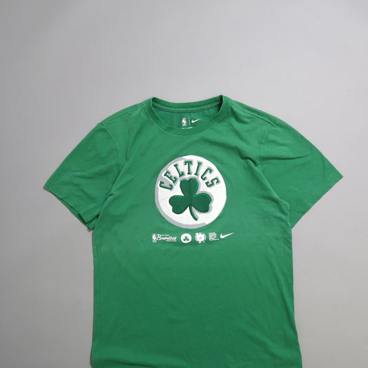 Green T-shirt with Celtics logo and shamrock design on front.