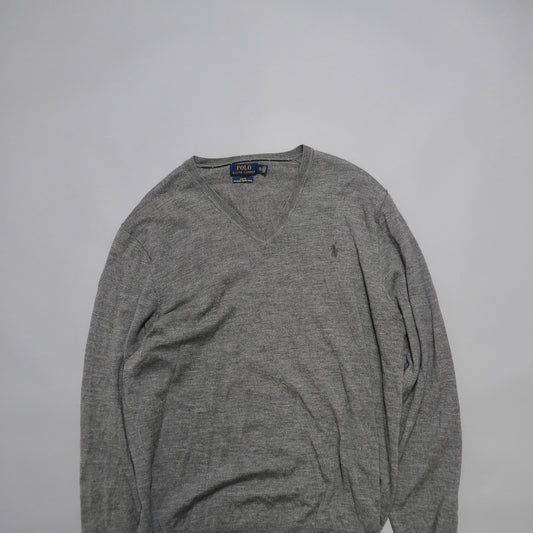 Gray V-neck sweater on a white background.