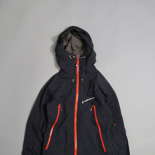 Black hooded jacket with red zippers on a gray background.