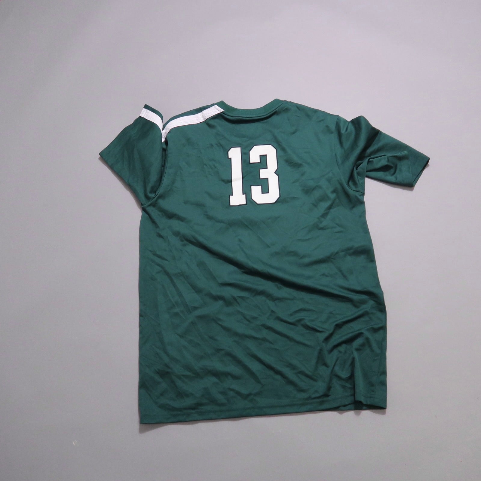 Green sports jersey with white number 13 on the back.