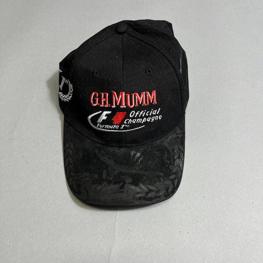 Black cap with nullG.H. Mumm Official Champagnenull and F1 logos.