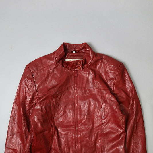 Red leather jacket with a textured finish on a plain background.