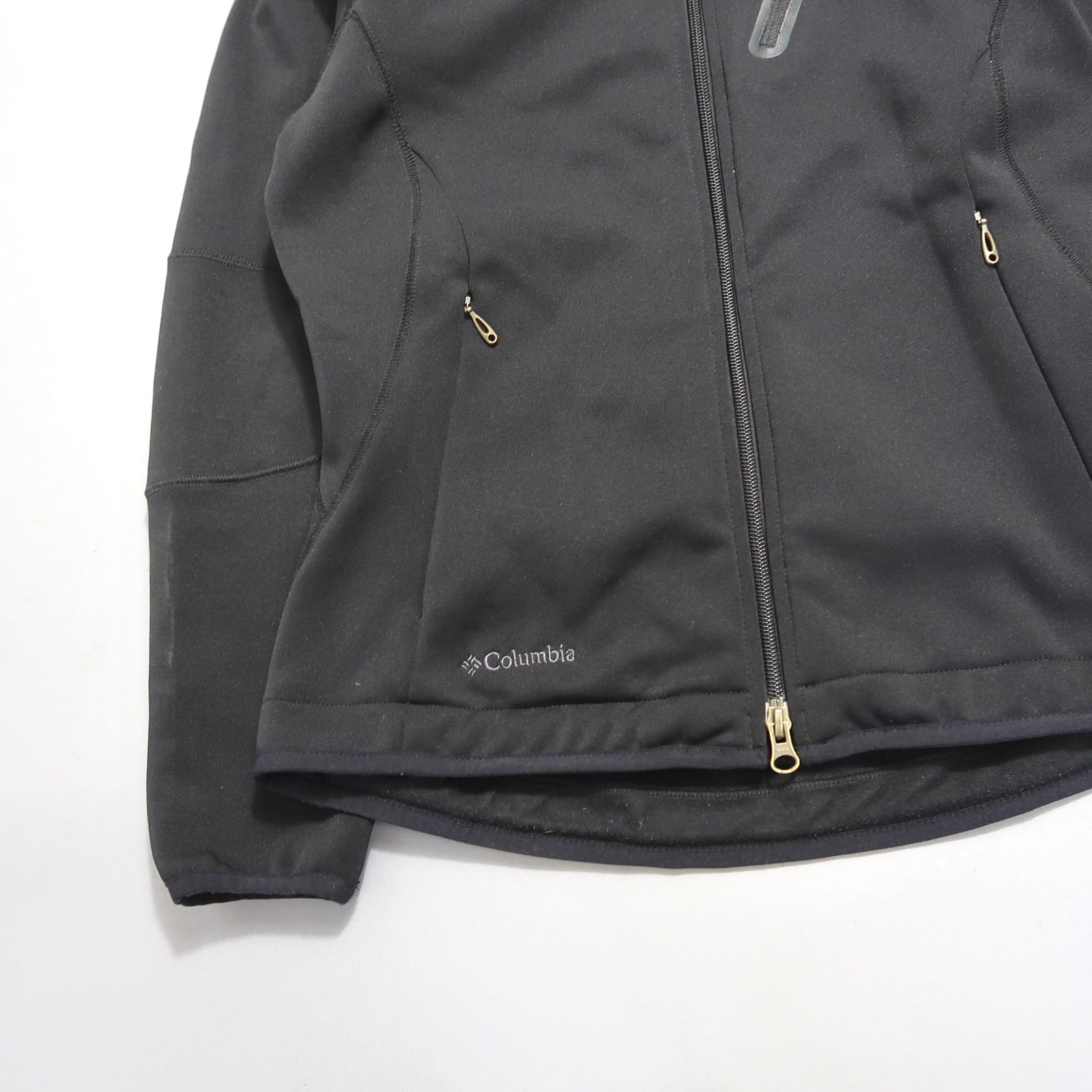 Black Columbia jacket with zippered pockets and visible logo.