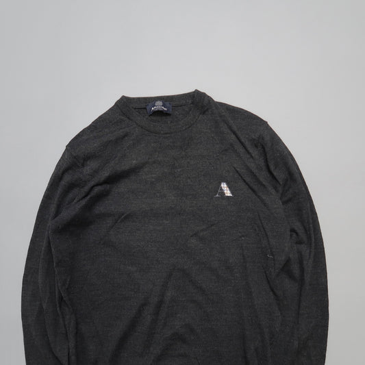 Dark gray sweater with a small nullAnull logo on the chest.