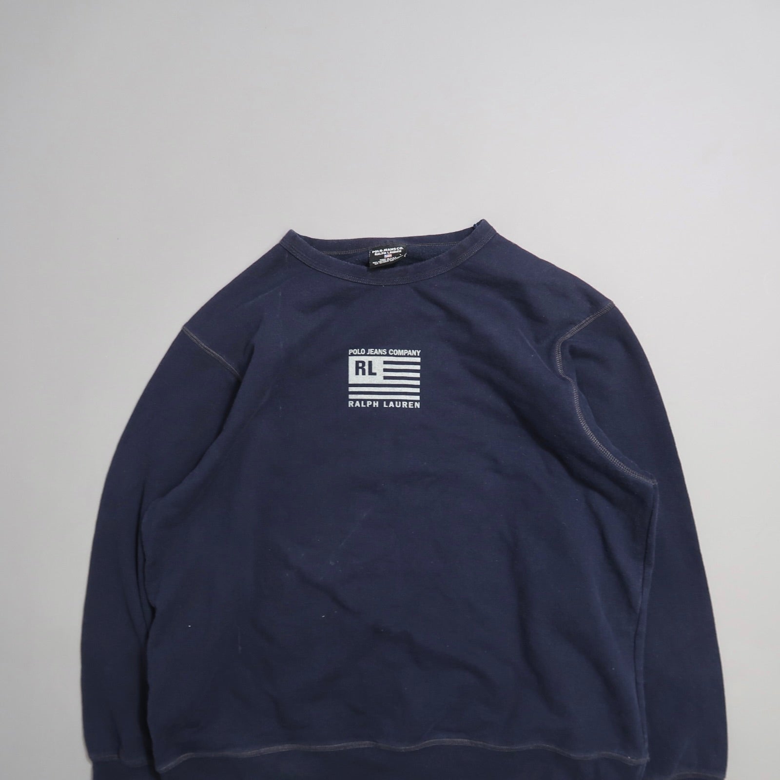 Navy blue sweatshirt with white nullPolo Jeans Companynull logo on front.