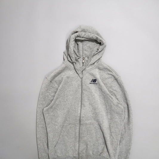 Gray New Balance hoodie with a zipper, laid flat on a white background.