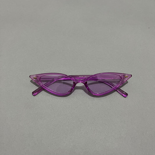 Purple cat-eye sunglasses on a gray background.