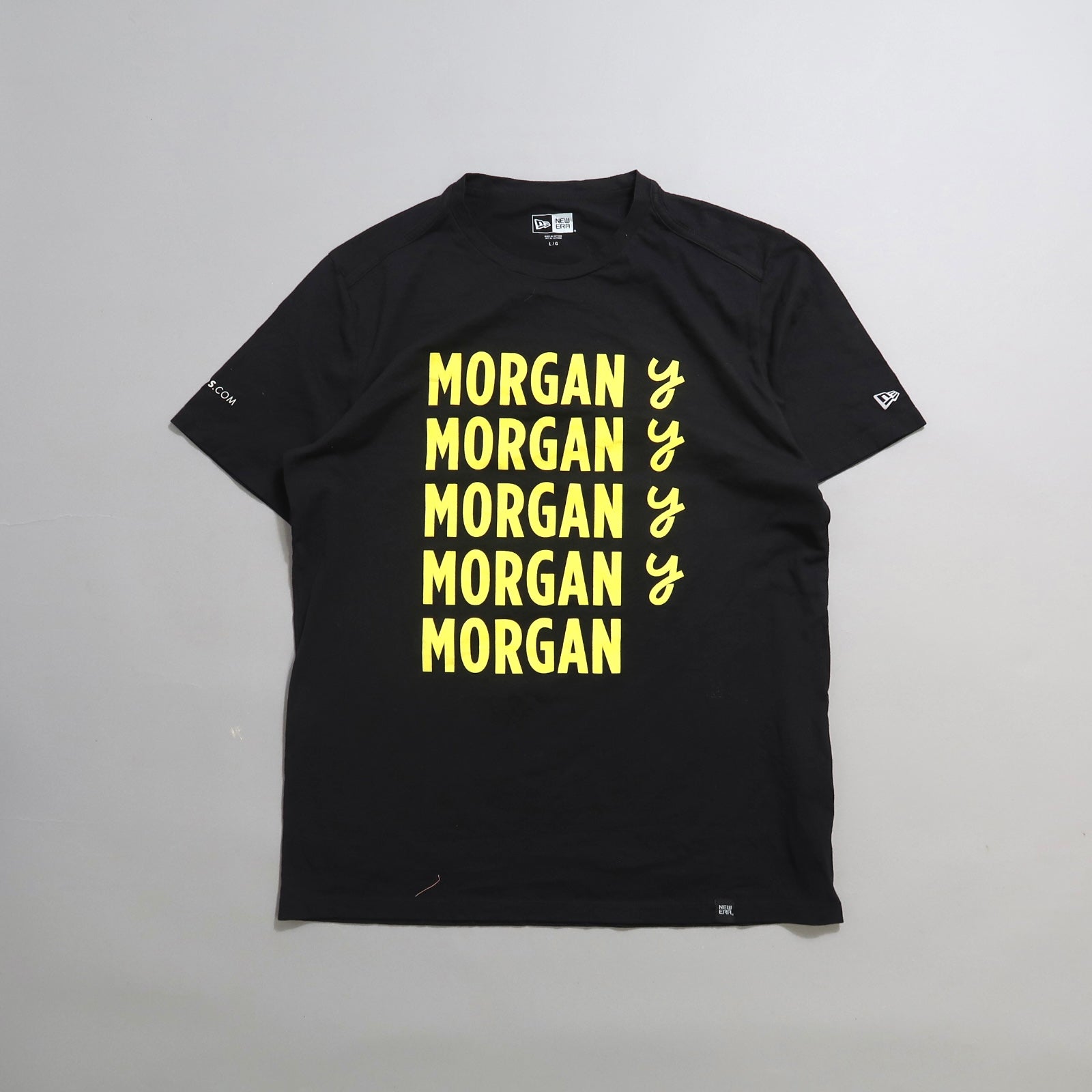 Black t-shirt with nullMORGANnull repeated in yellow text.
