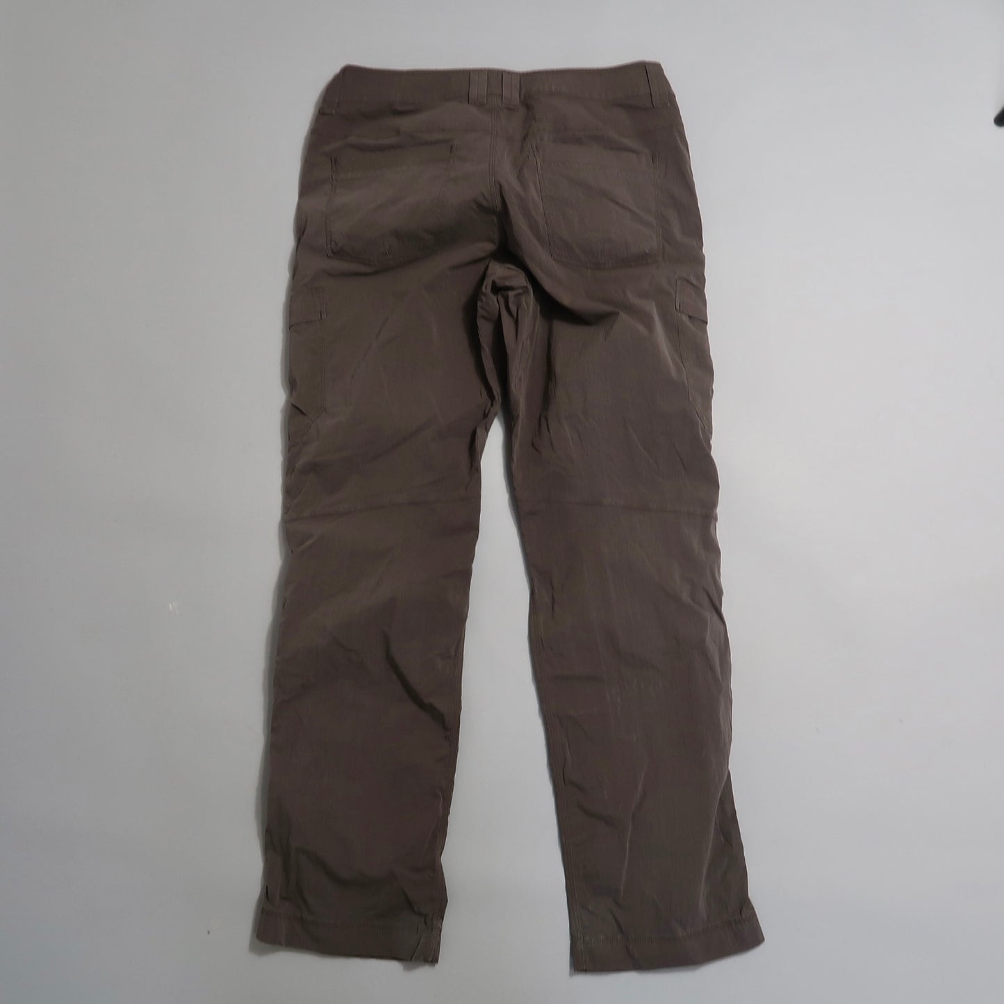 Brown pants displayed on a neutral background.