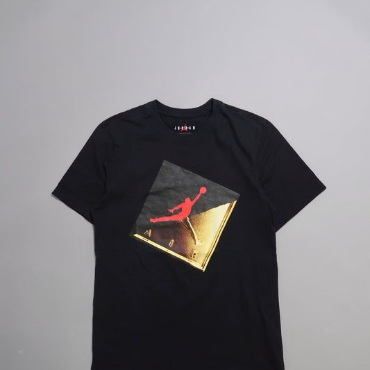 Black t-shirt with red and gold Jumpman logo graphic.