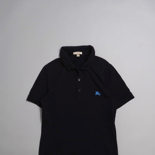 Black polo shirt with blue logo on chest, laid on a neutral background.