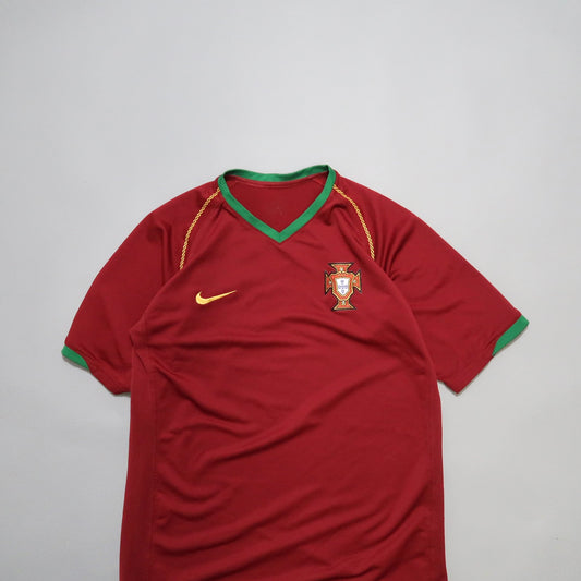 Red and green Portugal soccer jersey with logo and Nike swoosh.
