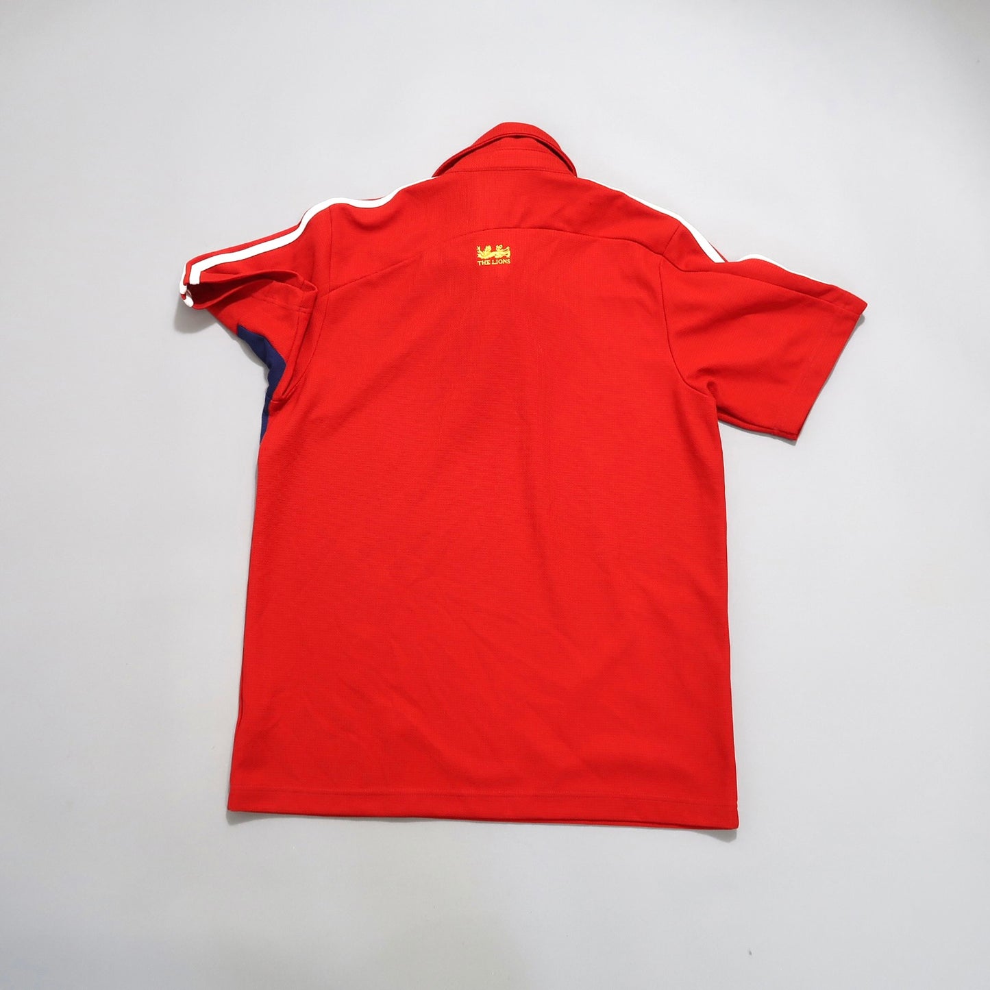 Red short-sleeve shirt with white stripes on the shoulders.