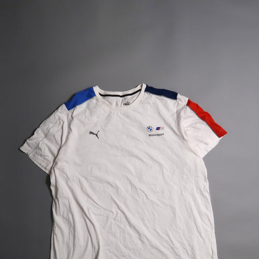White BMW Motorsport Puma T-shirt with blue and red shoulder accents.