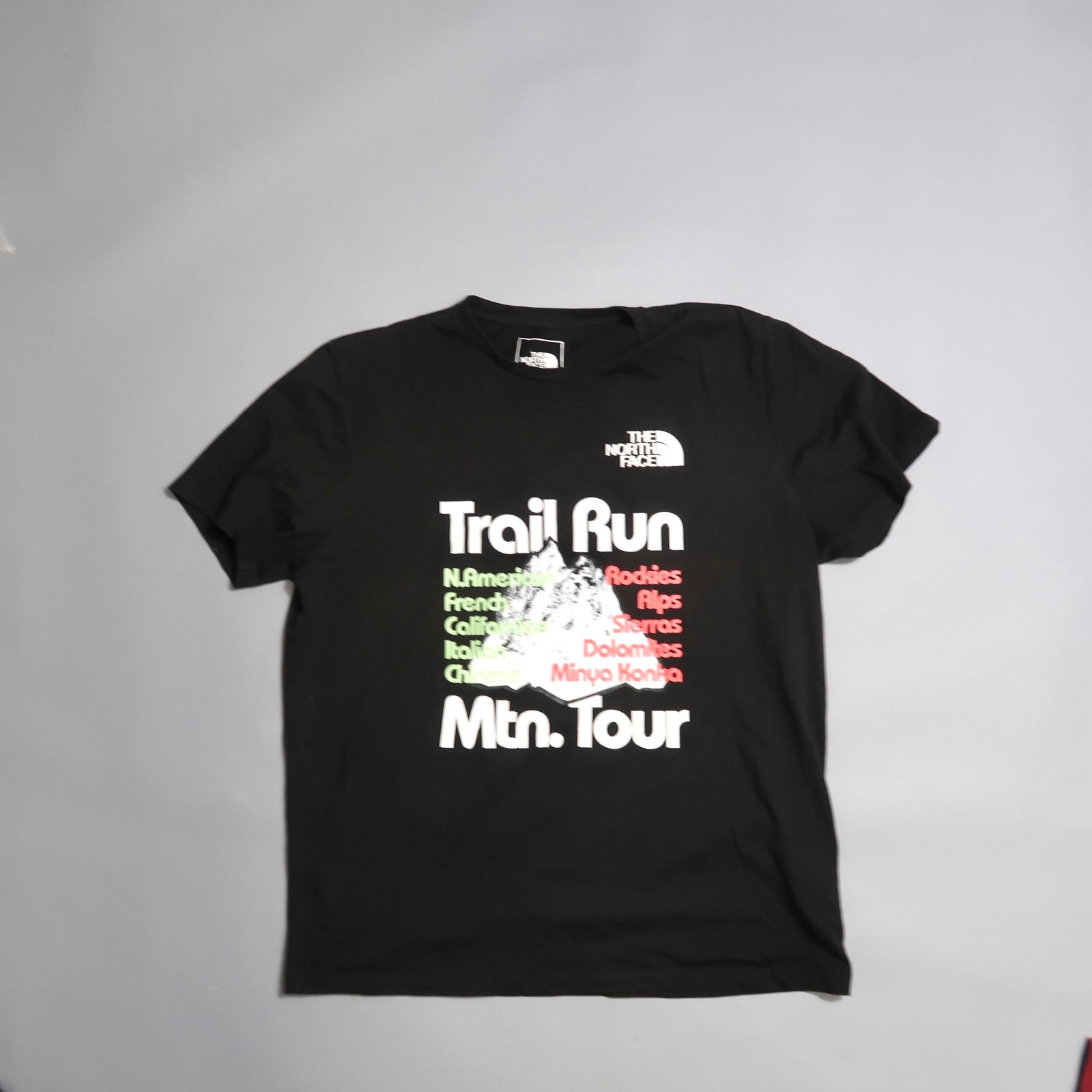 Black T-shirt with nullTrail Run Mtn. Tournull and mountains graphic.