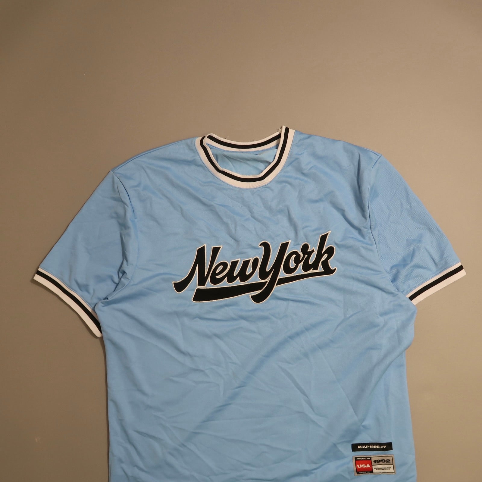 Light blue nullNew Yorknull jersey with black and white trim details.