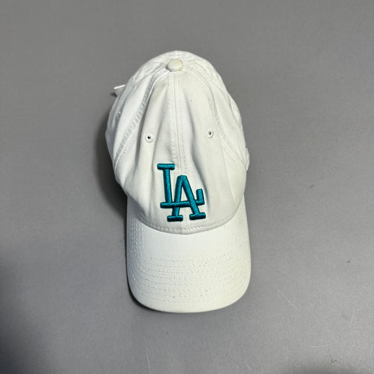 White cap with teal nullLAnull logo on a gray background.