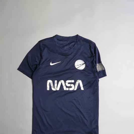 Navy blue NASA shirt with Nike logo and space-themed patches.