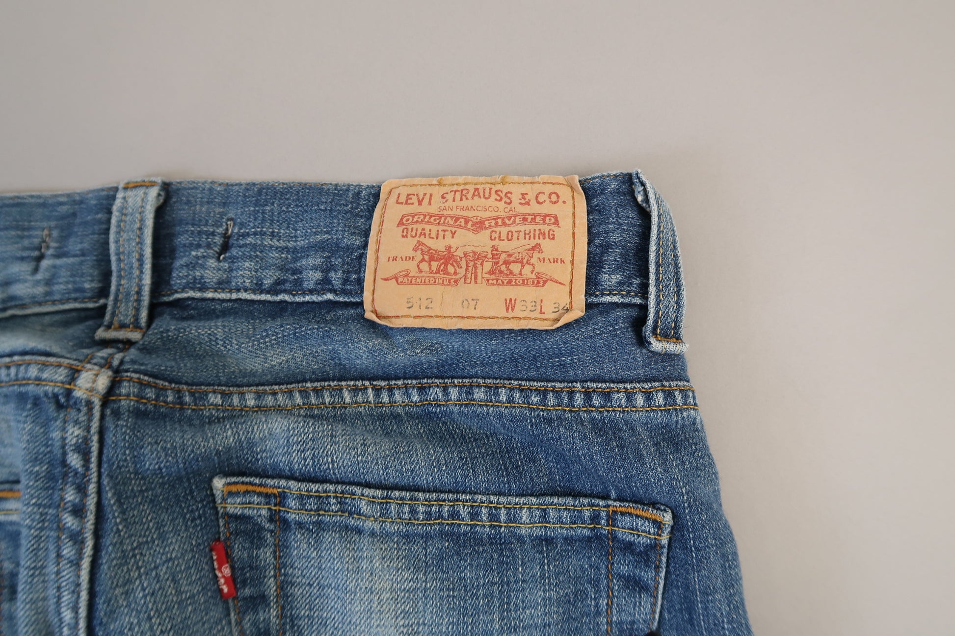 Back of blue jeans with Levi's label and pocket.
